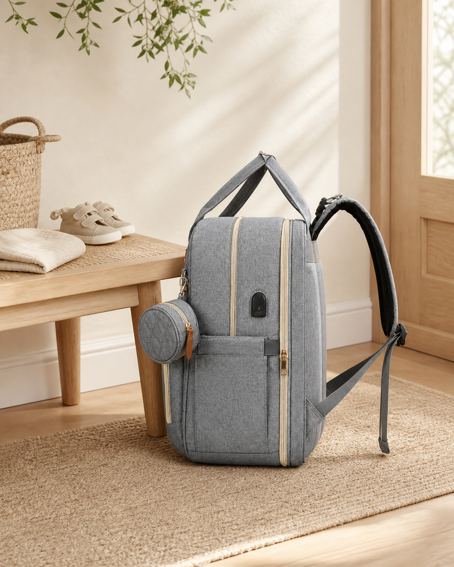 The Day Out Diaper Backpack styled in a calm family-home entryway